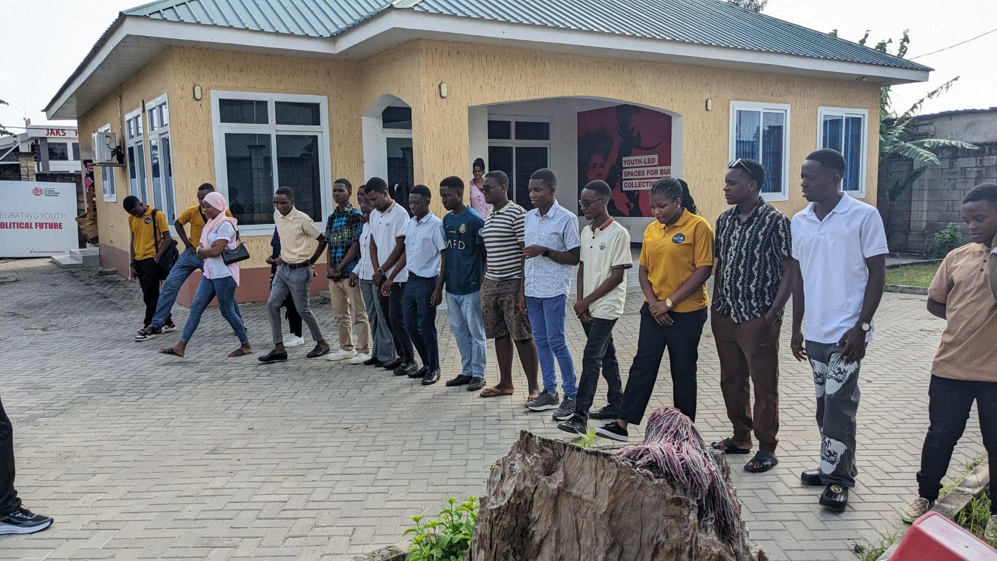 Participants taking part in an opening activity in the courtyard.